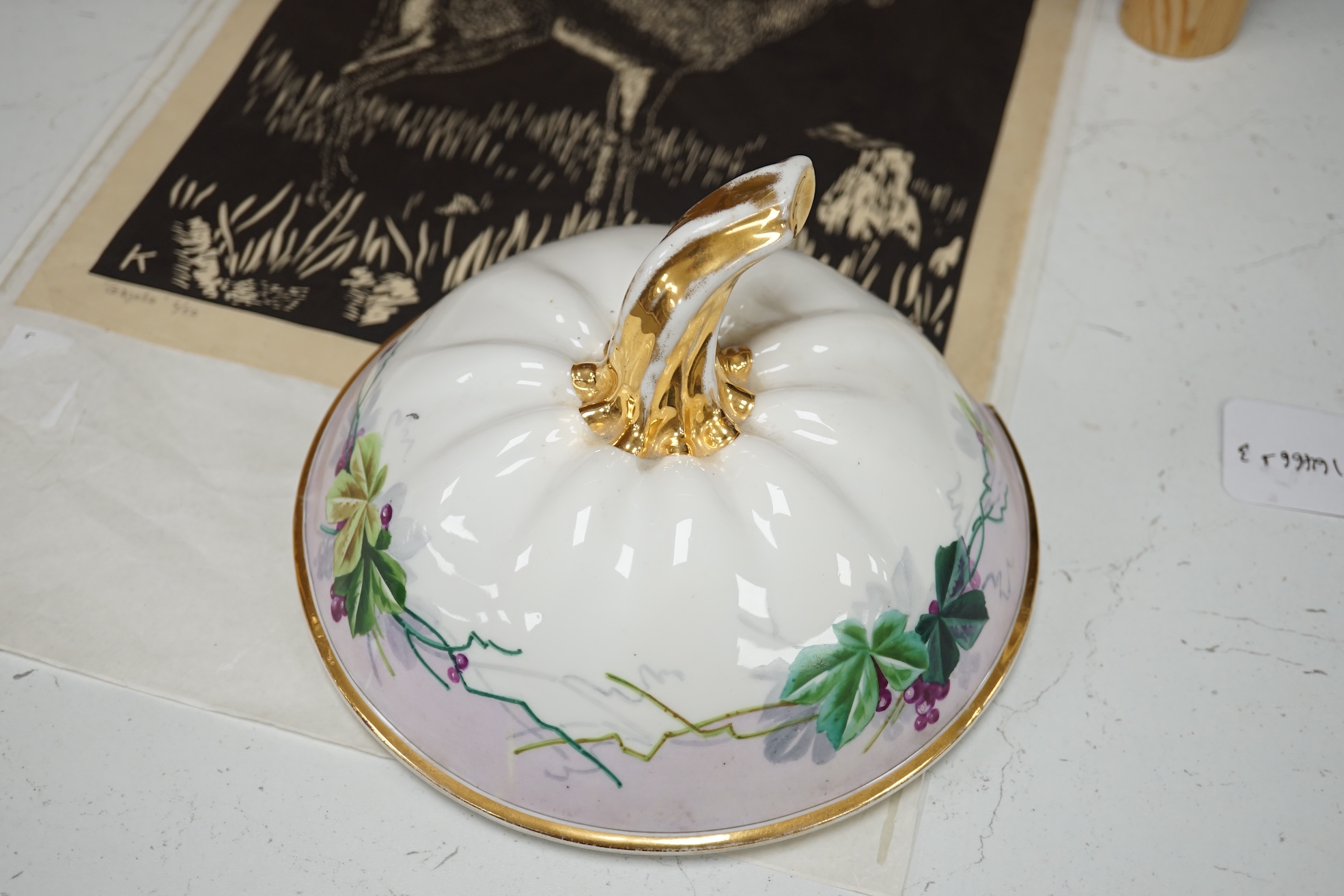 A Paris porcelain grape and vine painted punch bowl and cover, 27cm high. Condition - fair to good.